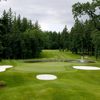 A view from the clubhouse of green protected by bunkers at Camas Meadows Golf Club