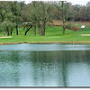 A view over the water of the 3rd hole at Cross Creek Golf Course