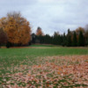 Eastmoreland #10: The fairway for hole #10 is narrow and lined with trees on both sides and two bunkers on the right. The two tiered green is elevated and surrounded by bunkers.