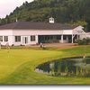 The Ocean Dunes Golf Links Clubhouse provides a wide variety of services. A full service pro shop and cafe are available. The putting green is partly pictured.