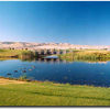 Water and the nearby Blue Mountains provide dramatic backstops to a beautifully maintained course. Water, like this along the course's signature 18th hole, a 408-yard par 4, provides challenge on nine of the course's 18 holes. The bridge crosses the water