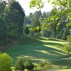 Hole #15: This photo was taken from the back of the green. The fairway is relatively open with the exception of the creek that runs along the right side and then cuts across the fairway about 50 yards from an elevated green. Trees line the left fairway.