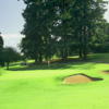 A view of the 11th green surrounded by bunkers at Waverley Country Club