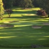 A view of a green protected by tricky sand traps at Portland Golf Club