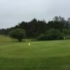 A view of a fairway and the practice area at Manzanita Golf Course