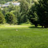 A sunny day view of a green at Bear Creek Golf Course.