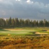 A sunny day view of a well protected green from Crosswater at Sunriver Resort.