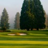 A view of a green and the clubhouse at Willamette Valley Country Club.