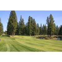 The 17th hole at Widgi Creek Golf Club is a par 5 guarded by water beside the green.